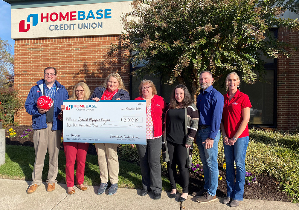 group presenting check to Special Olympics